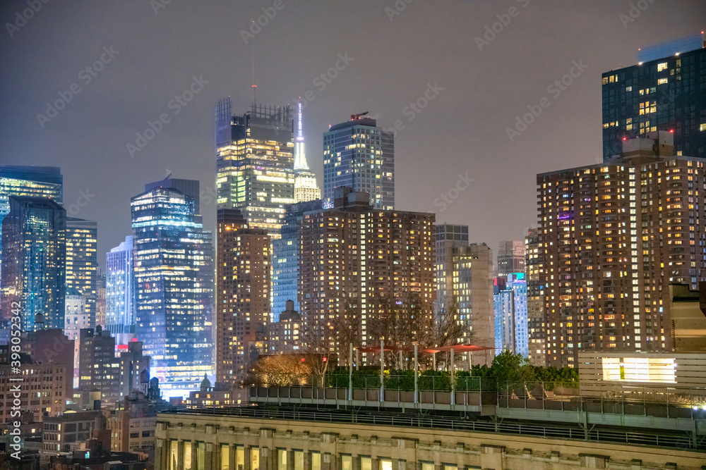 NEW YORK CITY - DECEMBER 1, 2018: Night skyline of Midtown Manhattan, aerial view at night NEW YORK CITY - DECEMBER 1, 2018: Night skyline of Midtown Manhattan, aerial view at night