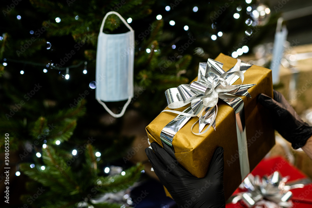 Christmas during the coronavirus pandemic | covid 19 - packing and decorating gifts with caution