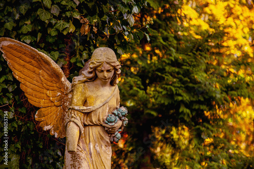 Sad guardian angel. Fragment of an antique statue. Free copy space for design or text.