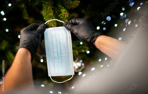decorating the Christmas tree - medical mask for the Christmas tree - coronavirus pandemic | COVID-19 | Merry Christmas - the realities of 2020