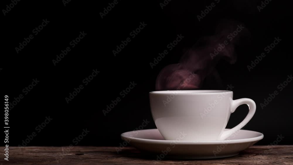 Coffee cup with natural steam smoke of coffee on dark background with copy space, slow motion. Hot Coffee Drink Concept. Coffee cup with natural steam smoke of coffee on dark background with copy space, slow motion. Hot Coffee Drink Concept.