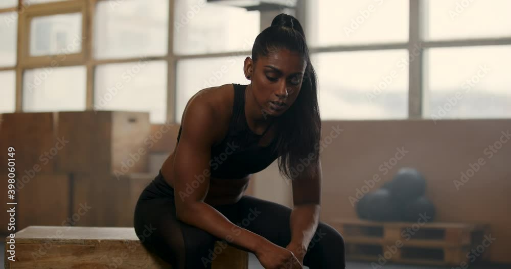 Fit young woman looking
exhausted after a gym workout
Fit young woman looking
exhausted after a gym workout
