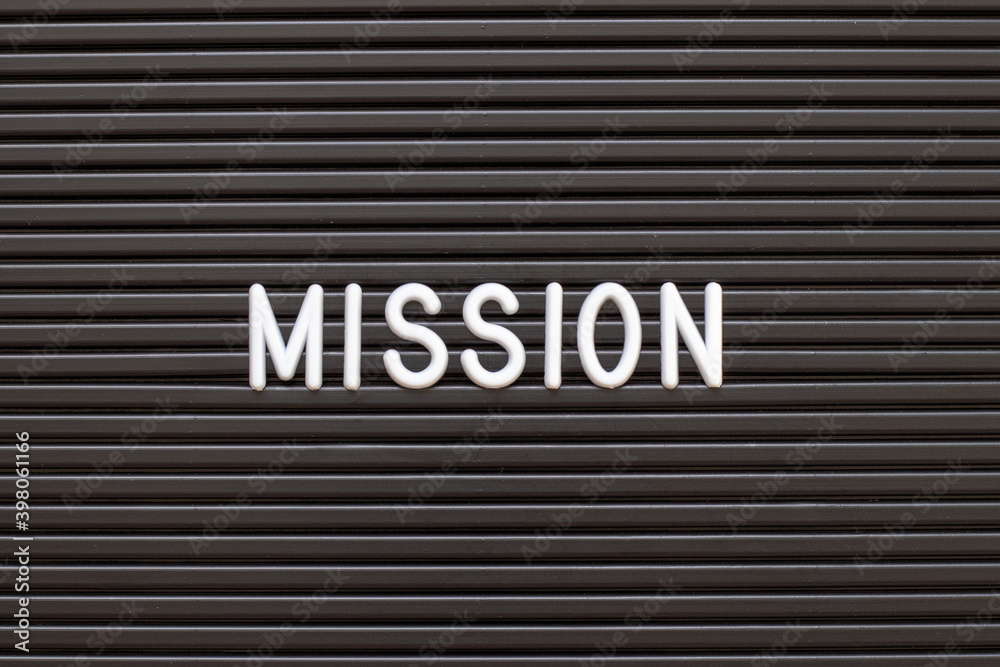 White alphabet in word mission on black color felt letter board background