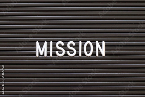White alphabet in word mission on black color felt letter board background