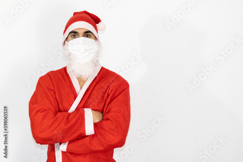  santa claus posing with crossed arms with mask