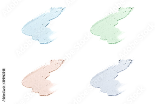 Smears of cosmetic clay isolated on a white background.