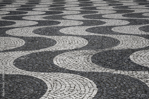 Characteristic wave pattern of cobblestone pavement on Rossio square  Lisbon  Portugal