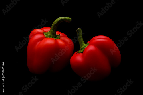 Canvastavla Two bell peppers on dark background