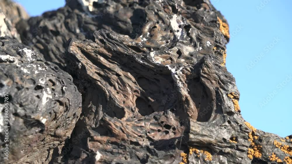 Solidified Igneous Lava Rock.Basalt Spongy structure porous crushed and broken stones frozen gibber reg regs geology geological clinkers scoria magmatic cinder 4K.
