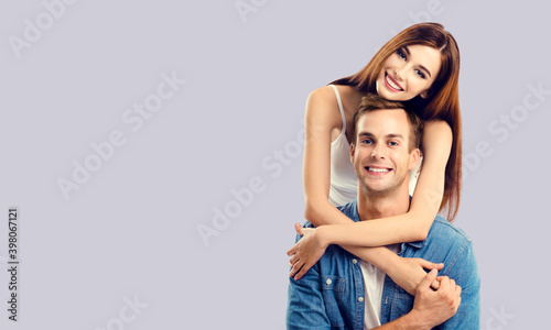 Love, relationship, dating, flirting, lovers, romantic concept - lovely embracing couple, isolated over grey background. Copy space for some text.
