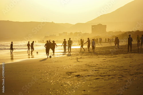 people playing football in beach of Mukalla City, Yemen, 2020