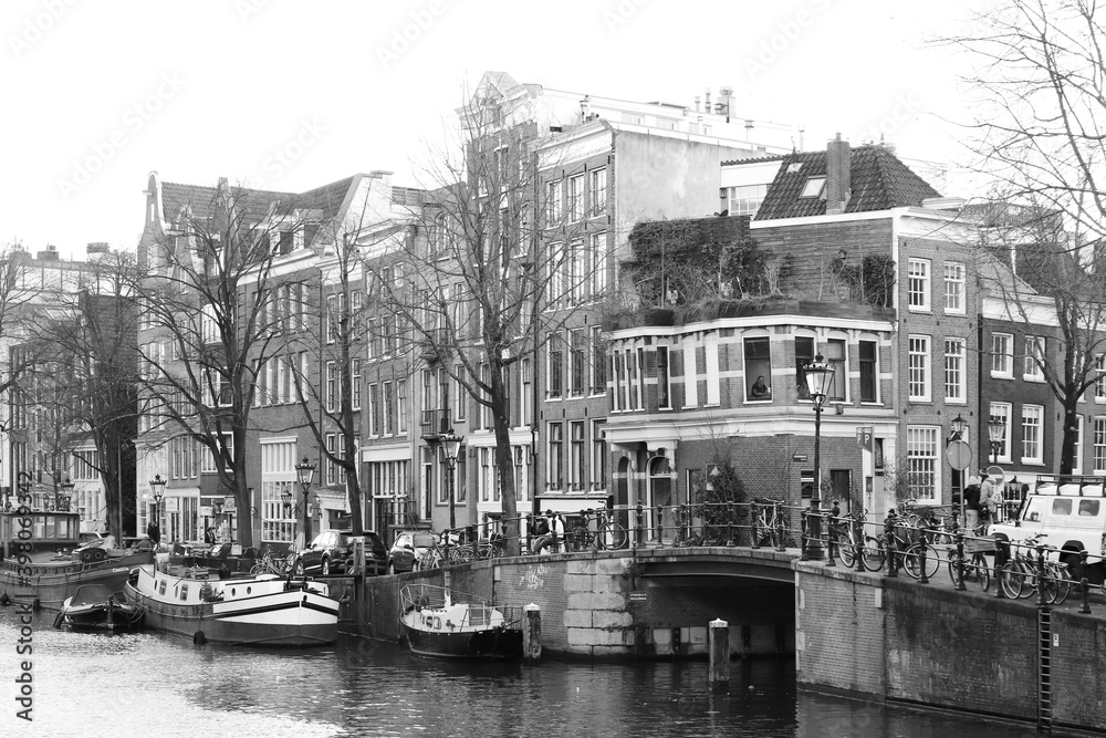 View of Amsterdam Canal with Houses and Bridge