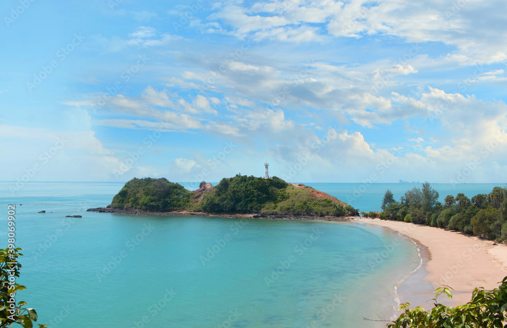 Fototapeta premium The lighthouse on the island and the blue sky taken from above