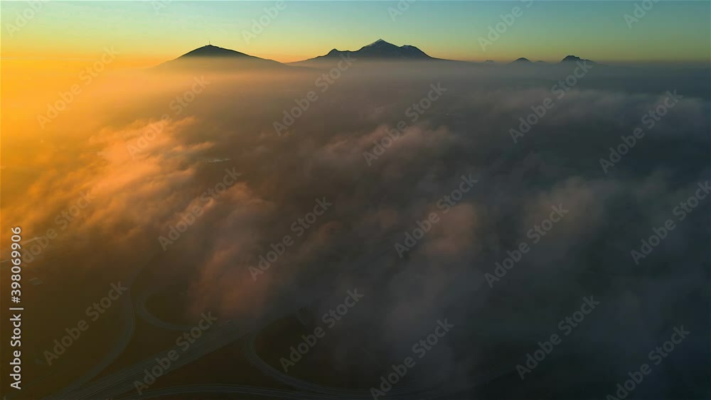 Sunrise over the Beshtau mountains and low clouds. Location Russia, Pyatigorsk. Copter Sunrise over the Beshtau mountains and low clouds. Location Russia, Pyatigorsk. Copter