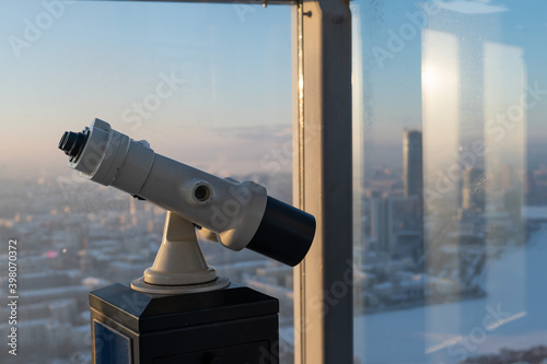 Fototapeta Binoculars on the observation deck of a skyscraper.