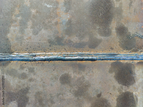 Spatter and porosity on welded, Defect of welding process Flux Cored Arc Welding (FCAW)