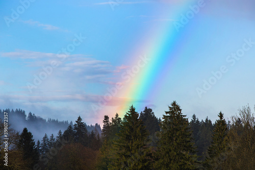 Landscape of Bavarian mountains with rainbow