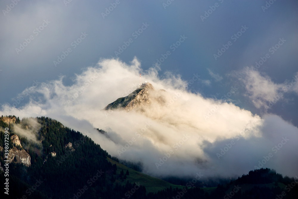 Bavarian mountain Wendelstein with fog in autumn