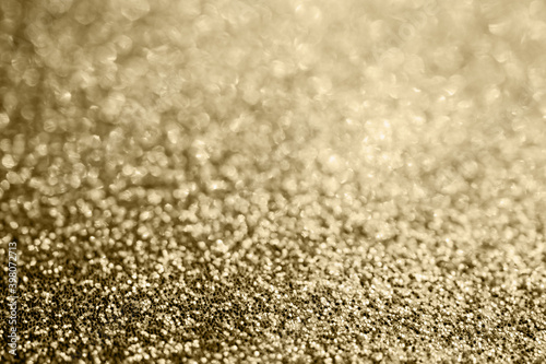 Abstract gold glitter sparkle blurred with bokeh background