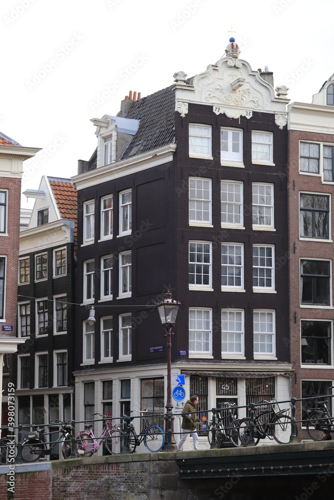 Fototapeta premium Street View in Amsterdam with Old Houses and Bridge