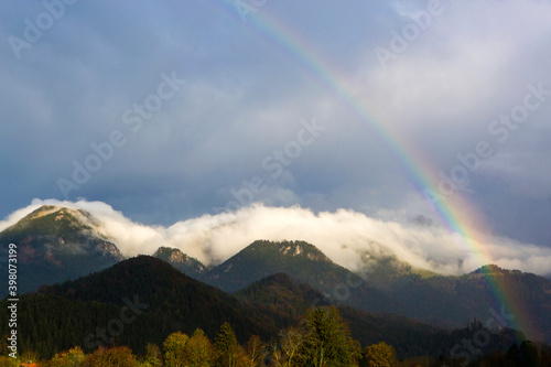 Landscape of Bavarian mountains with rainbow