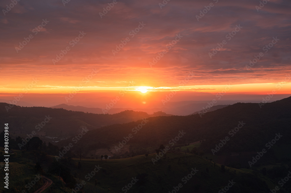 Sunrise on agricultural hill in countryside at morning Sunrise on agricultural hill in countryside at morning