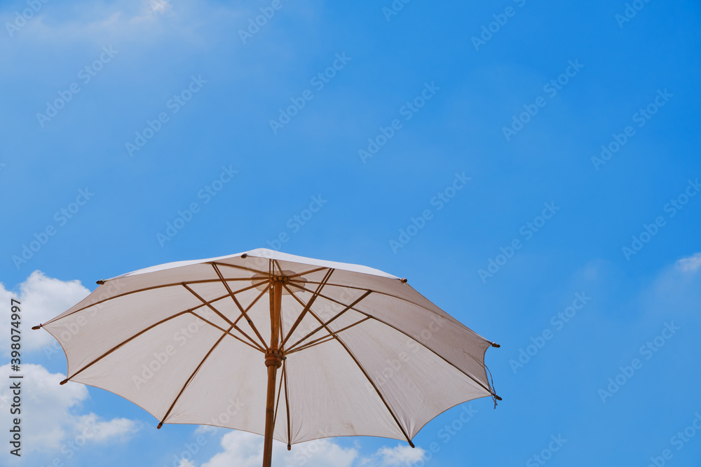 Parasol with blue sky background