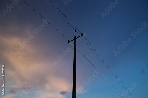 Power lines against the background of the evening sky.