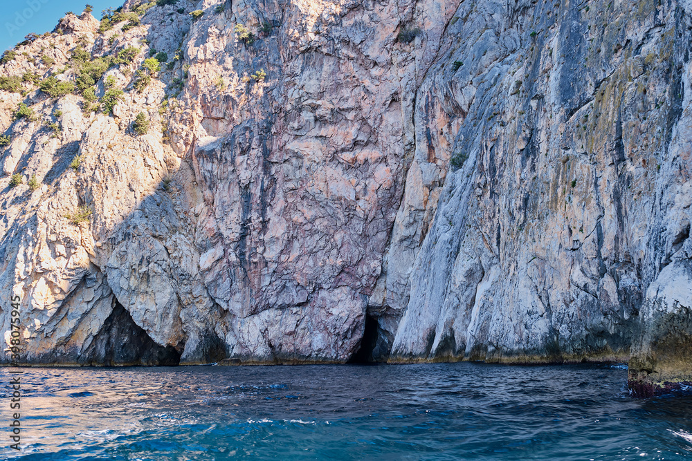Rocky coast and grottos of the cape Aya. Balaclava environs, Sevastopol, Crimean peninsula, Russia.