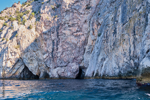 Rocky coast and grottos of the cape Aya. Balaclava environs, Sevastopol, Crimean peninsula, Russia. © IrinaK