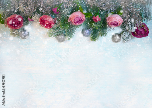 Christmas and new year holidays concept with snowy fir branches and flowers