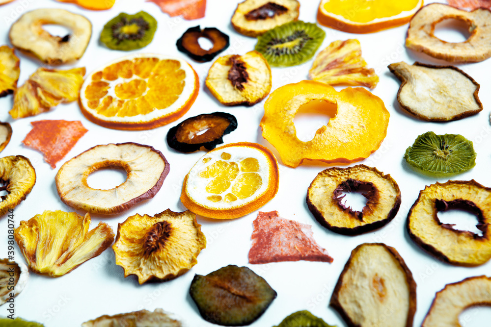 Organic Healthy Assorted Dried Fruit Mix close up. Dried fruit snacks. dried apples, mango, feijoa, dried apricots, prunes top view