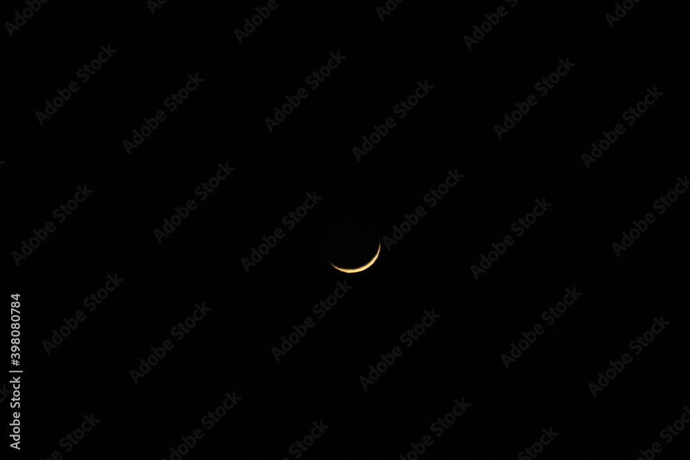 black sky and c-shaped moon, narrow crescent moon, bright highlighted color black sky and c-shaped moon, narrow crescent moon, bright highlighted color