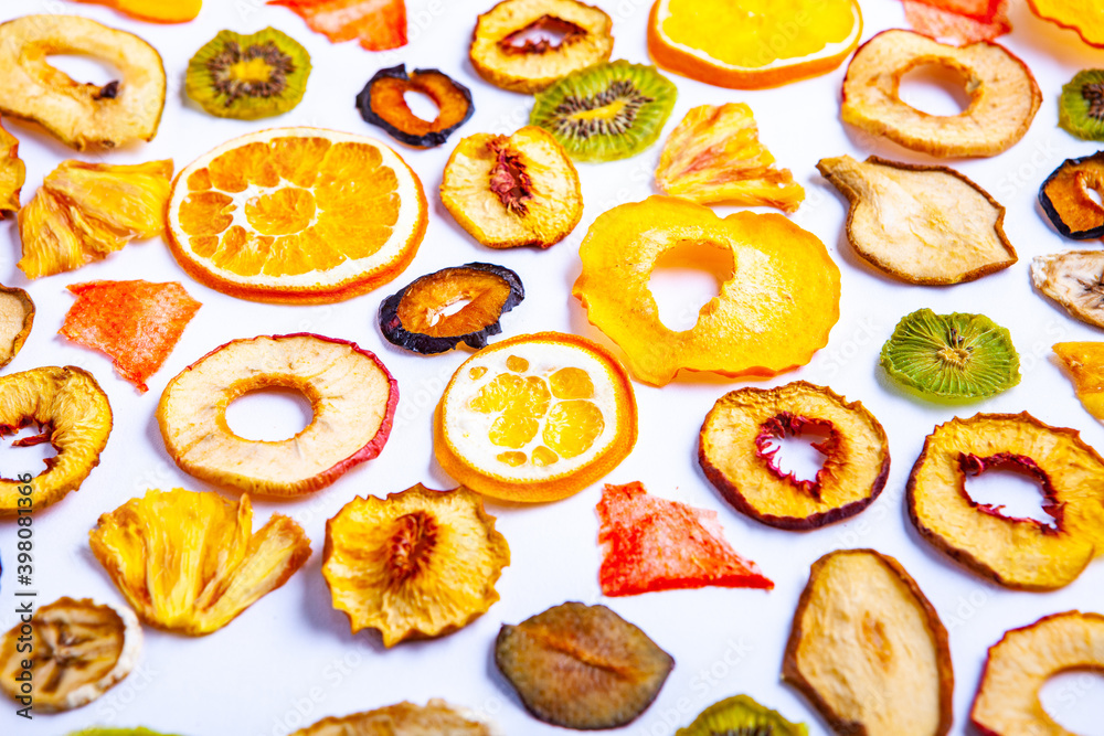 Organic Healthy Assorted Dried Fruit Mix close up. Dried fruit snacks. dried apples, mango, feijoa, dried apricots, prunes top view Organic Healthy Assorted Dried Fruit Mix close up. Dried fruit snacks. dried apples, mango, feijoa, dried apricots, prunes top view