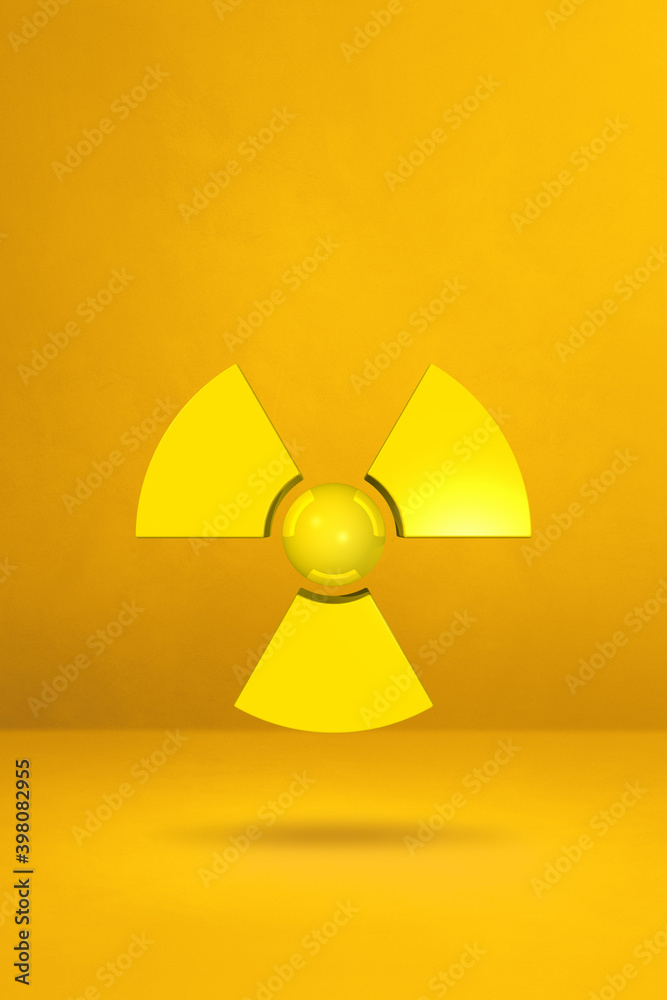 Radioactive symbol on a yellow studio background Radioactive symbol on a yellow studio background
