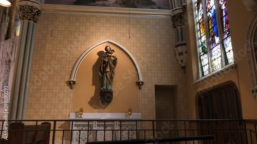 Statue and Stained Glass in Peaceful Ambience of Saint Alphonsus Church, Chicago USA, Slow Motion photo