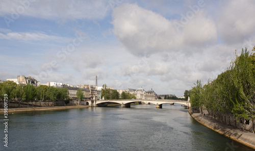 View of the Carrousel bridge. People walk along the Quay of the Tuileries