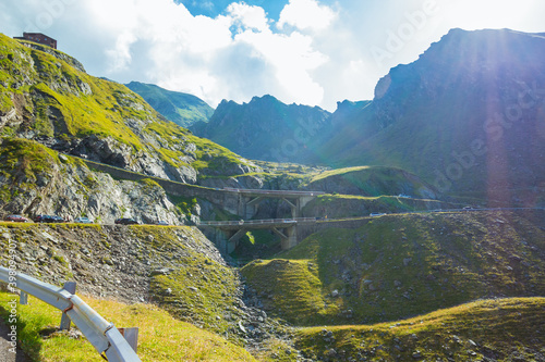 Majestic landscape of summer mountains. View of hills in rays of sunlight. Fagaras Mountains.Transylvania. Romania. Travel backdrop. Amaizing view from down on the Transfagarasan alpine mountain road photo