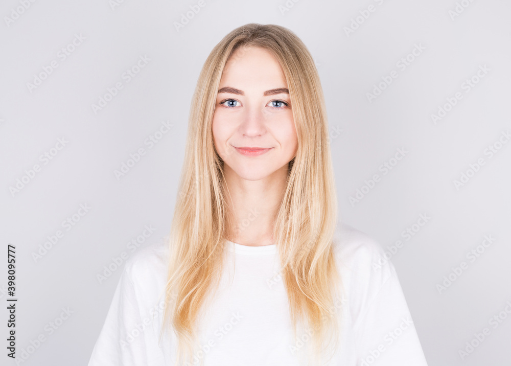 Happy cheerful young blonde teen looking at camera with joyful and charming smile. Happy cheerful young blonde teen looking at camera with joyful and charming smile.