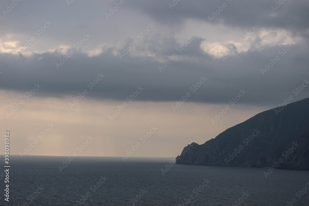 sun rays shine through the stormy clouds over Black sea in Crimea sun rays shine through the stormy clouds over Black sea in Crimea