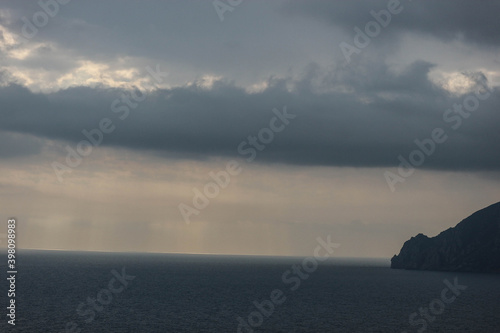 sun rays shine through the stormy clouds over Black sea in Crimea © Sergei Timofeev