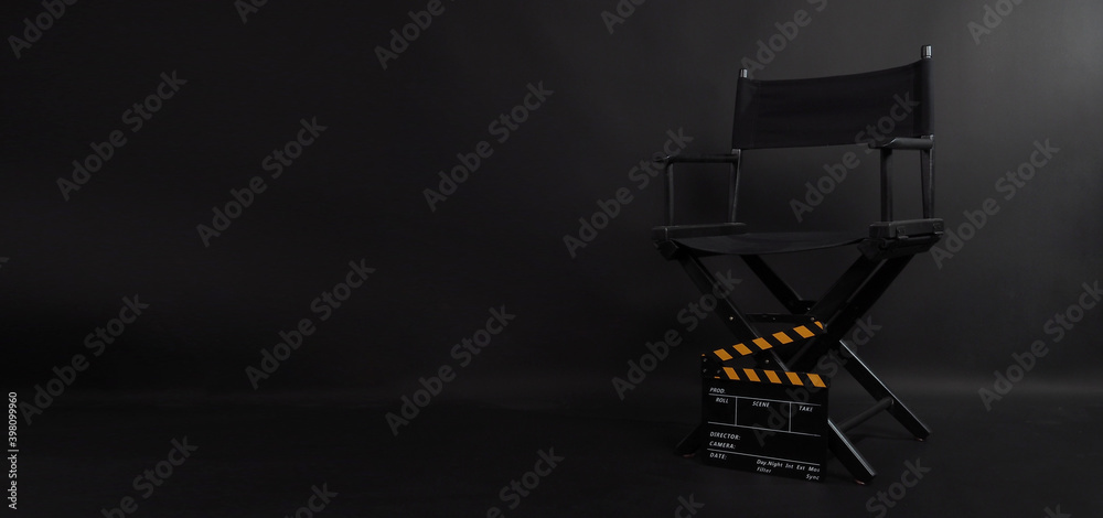 Director chair and Clapper board or movie slate use in video production , film ,movie and cinema industry. It's put on black blackground. - obrazy, fototapety, plakaty 
