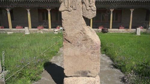 Historical Bugut Inscription in Ikh-Tamir Sum of Arkhangai Mongolia.Bugut inscription is a multi-lingual inscription in Ikh-Tamir sum of Arkhangai Province, Mongolia. Deer stones are ancient megaliths photo