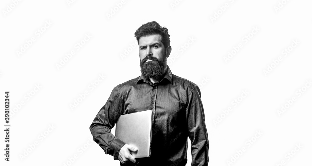 Obraz premium Young businessman using his laptop, pc. Holding laptop computer. Serious handsome bearded man worker laptop