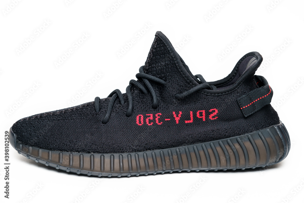 Moscow, Russia - December 2020 : Adidas Yeezy Boost 350 V2 CORE BLACK/RED -  Famous Limited Collection Fashion Sneakers by Kanye West and Adidas  Collaboration Stock Photo | Adobe Stock