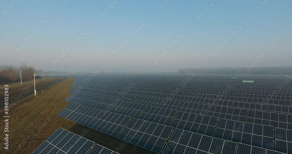Solar panels. solar panel field. Flight over a large solar station near the forest. Clean Alternative power energy concept Solar panels. solar panel field. Flight over a large solar station near the forest. Clean Alternative power energy concept