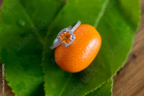 mandarain garnet wedding band against orange kumquat