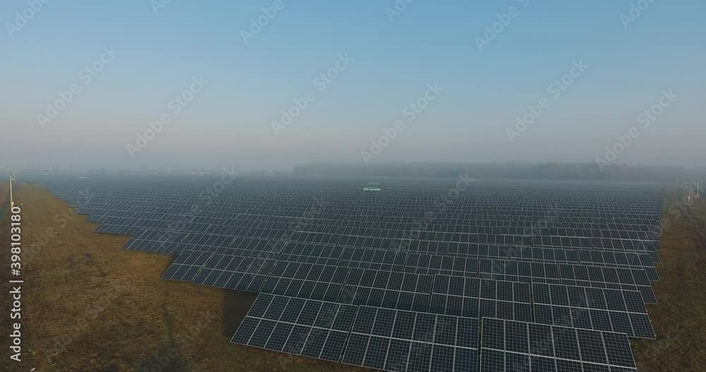 Solar panels. solar panel field. Flight over a large solar station near the forest. Clean Alternative power energy concept Solar panels. solar panel field. Flight over a large solar station near the forest. Clean Alternative power energy concept