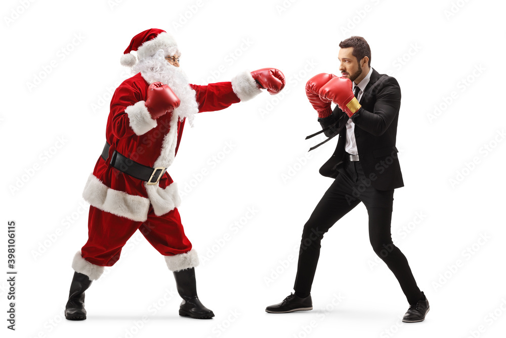 Full length profile shot of a businessman and santa claus training box Full length profile shot of a businessman and santa claus training box