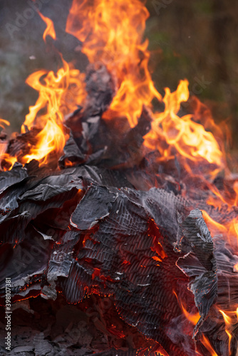 Pile of burning cardboard and waste paper